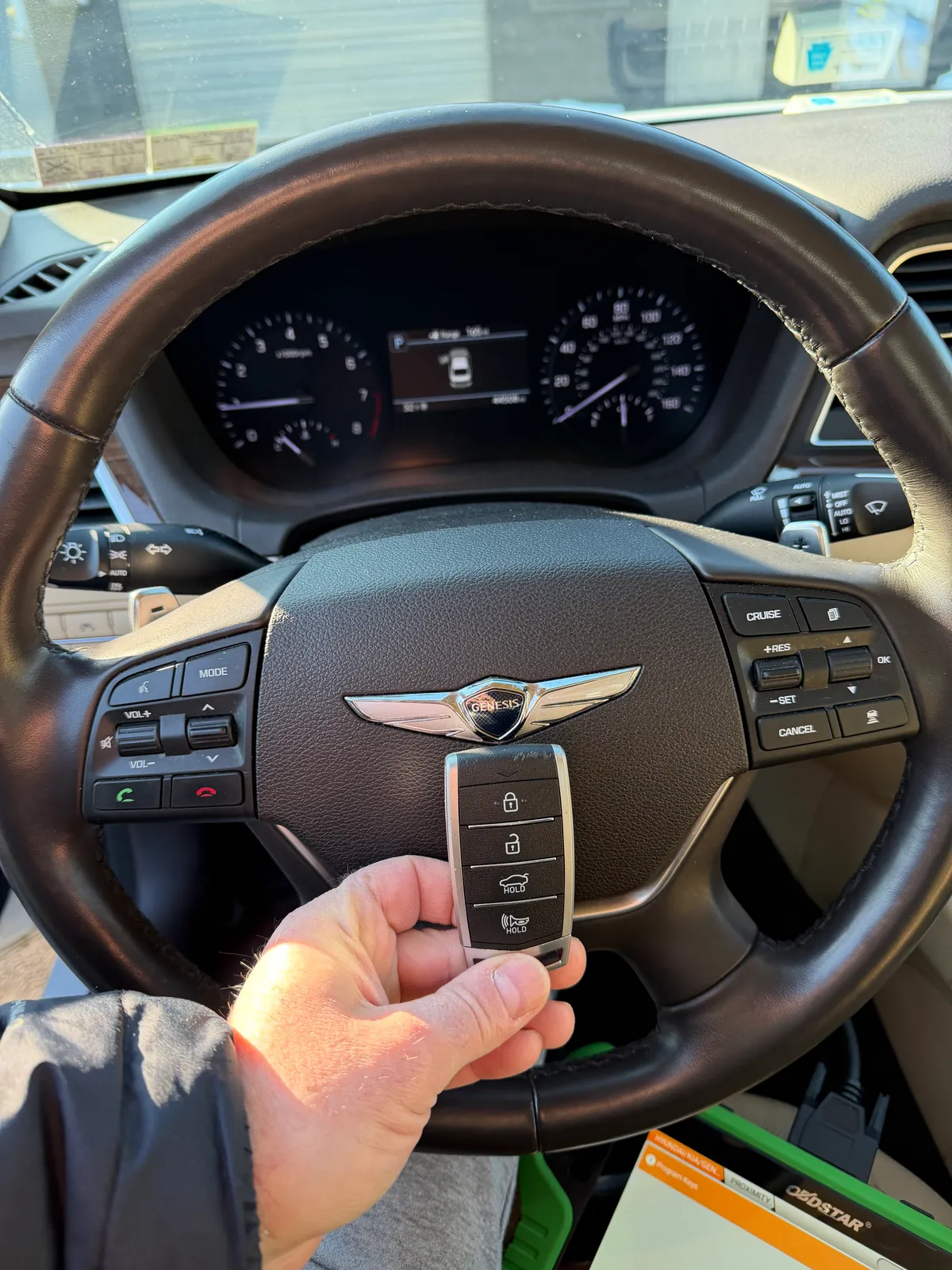 Freshly programmed 2021 Genesis G80 smart key — Hyundai-platform proximity fob paired on-site to the vehicle's immobilizer