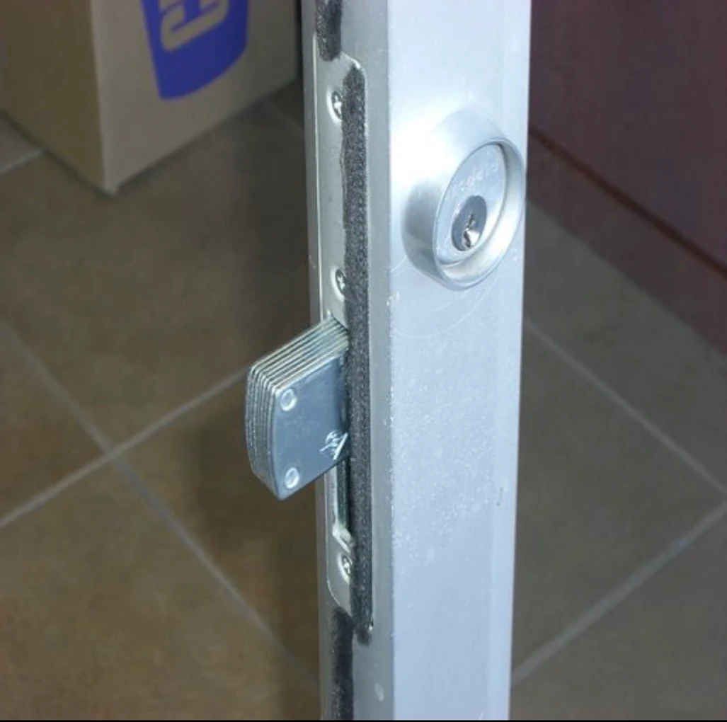 Adams Rite storefront lock with mortise cylinder, completed installation